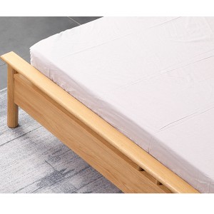 Heightened guardrail at the end of the bed